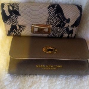 TWO BEAUTIFUL WALLETS NEVER USED. BOTH FOR THE PRICE OF ONE